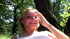 Sweet German teen pleasing her tight pussy in the woods
